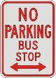 NO PARKING BUS STOP with double arrow sign R7-7