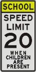 SCHOOL, SPEED LIMIT 20, WHEN CHILDRENARE PRESENT sign